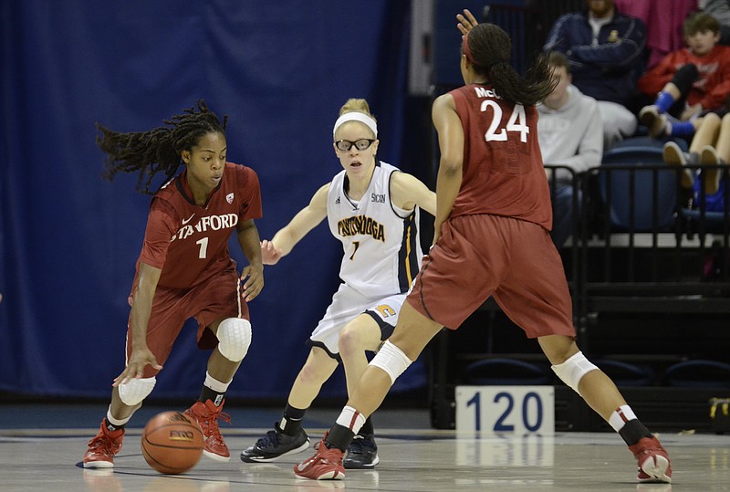 UTC's Alicia Payne gets some 1-on-1 action against Lili Thompson (1) before being blocked by Erica McCall (24) during a 54-46 UTC victory against Stanford at McKenzie in Chattanooga, Tenn., on Wednesday, December 17, 2014.