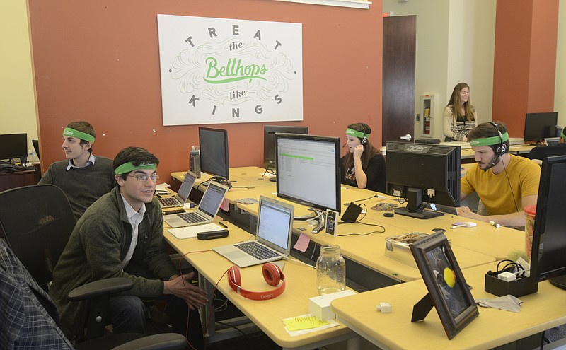 Matt Intemann, Adam Shearer, Tisha Blankenship and Jacob Ellis, from left, work Wednesday at Bellhops. Bellhops is the first of three businesses to receive the City of Chattanooga's Growing Small Business incentives.
