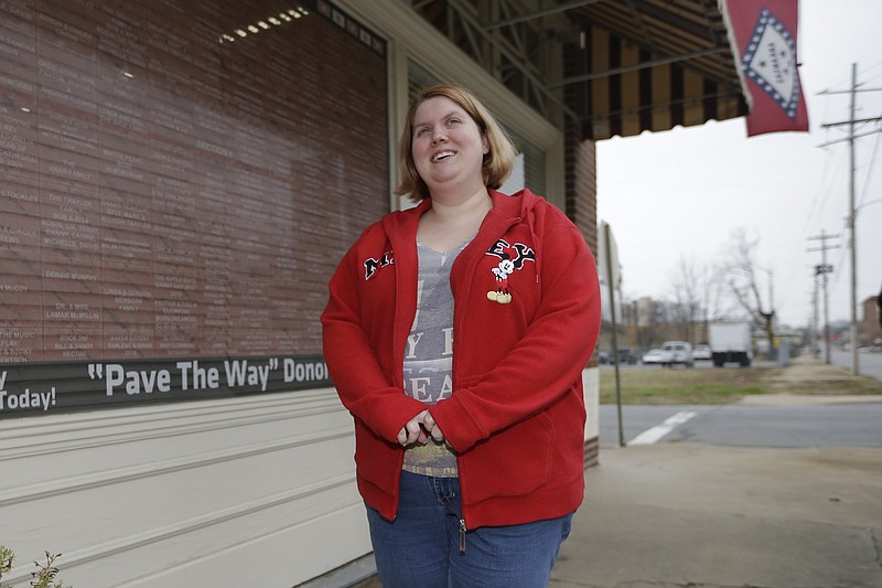 
              In this photo taken Dec. 11, 2014, Arwen Dover is interviewed near her employer's store in Little Rock, Ark. Dover participates in a program in Arkansas that expand its Medicaid program in a way that many Republicans found acceptable. The state bought private insurance for low-income people instead of adding them to the rolls of a system GOP lawmakers called bloated and inefficient. (AP Photo/Danny Johnston)
            