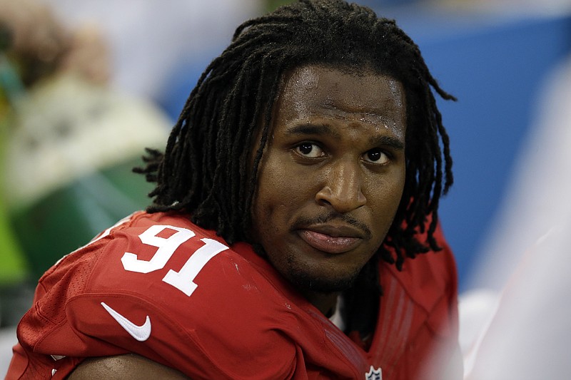 In this Sept. 7, 2014, file photo, San Francisco 49ers' Ray McDonald sits on the bench during the second half of an NFL football game against the Dallas Cowboys in Arlington, Texas. Northern California authorities are investigating 49ers defensive lineman Ray McDonald on suspicion of sexual assault. San Jose Police Department Sgt. Heather Randol said Wednesday, Dec. 17, 2014, that detectives searched McDonald's San Jose home.
            