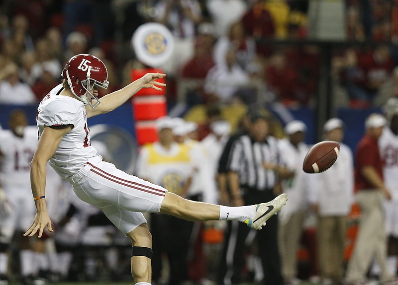 Alabama punter JK Scott (15) kicks the ball against Missouri during the first half of the Southeastern Conference championship game on Dec. 6 in Atlanta.