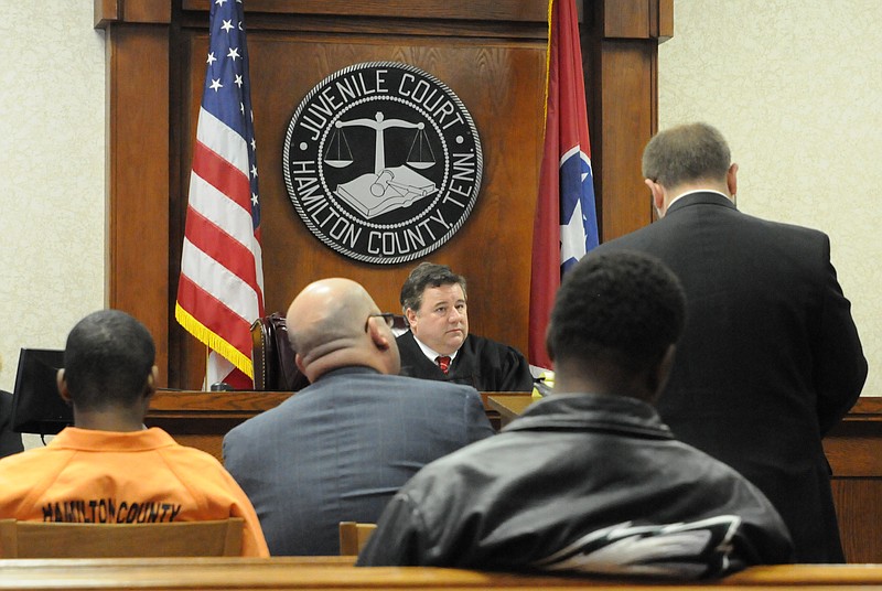 Hamilton County Juvenile Court Judge Robert D. Philyaw listens to testimony in the case of Deonte Smart, charged with the rape of an elderly male jogger, before ruling that the 17-year-old will be tried as an adult in this file photo.