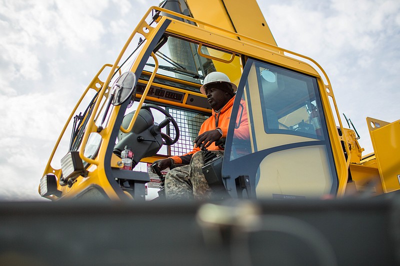 Former student Nathaniel Simmons operates a crane during a day of training at Georgia College of Construction in this Nov. 25, 2014, photo. The  Labor Department releases weekly jobless claims on Thursday, Dec. 18, 2014.