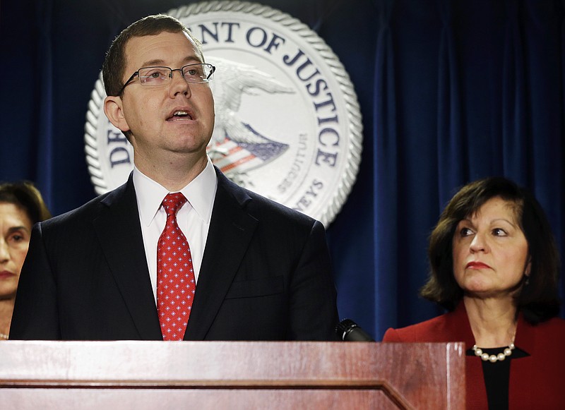 
              Associate Attorney General Stuart Delery speaks after U.S. Attorney Carmen Ortiz, right, announced indictments of 14 owners and employees from the New England Compounding Center Wednesday, Dec. 17, 2014, in Boston. More than 750 people in 20 states were sickened, and 64 died after they contracted fungal meningitis and other illnesses in 2012 from tainted steroids made by the Framingham, Mass., company.  (AP Photo/Steven Senne)
            