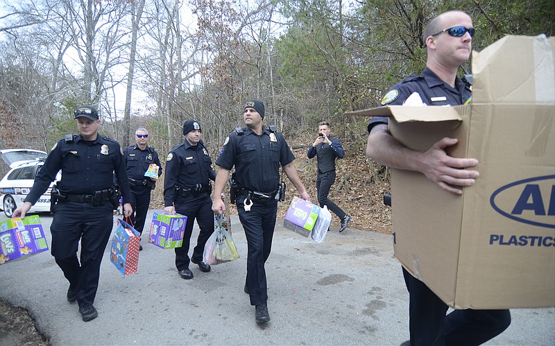 Chattanooga police officers deliver donations collected for Journee Akins and her family. Journee's mother, Jasmine Akins, was killed in September.
