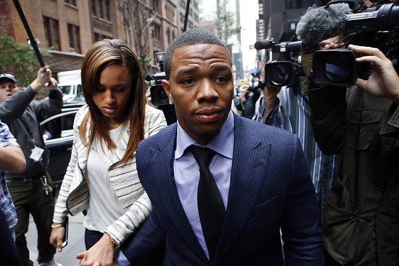
              FILE - Ray Rice arrives with his wife Janay Palmer for an appeal hearing of his indefinite suspension from the NFL, in this Wednesday, Nov. 5, 2014 file photo taken in New York. A video released Friday Dec. 19, 2014 shows Ray Rice's then-fiancee crying and kissing him while they are both handcuffed and being taken to jail by police officers after Rice punched her in a casino elevator.  (AP Photo/Jason DeCrow, File)
            