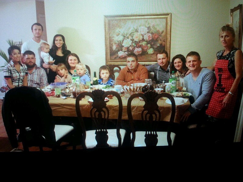 Oksana Potozka with her children and grandchildren in the home she rents in Ooltewah, Tenn.
Pictured from right to left, Oksansa Potozka, her son Nick, daughter Rosita and son-in-law Mark, her son-in-law Andrew, grandsons Jacob and Noah, daughter Lily, granddaughter Emma, daughter-in-law Allah, granddaughter Ava, sons Archie and Ross, and daughter-in-law Julia.