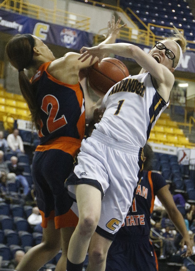 Morgan State forward Dinah Jones, left, knocks the ball from UTC guard Alicia Payne's hands as she shoots during the Mocs' women's basketball game against the Bears in the Chattanooga Christmas Classic on Saturday, Dec. 20, 2014, at McKenzie Arena in Chattanooga, Tenn.