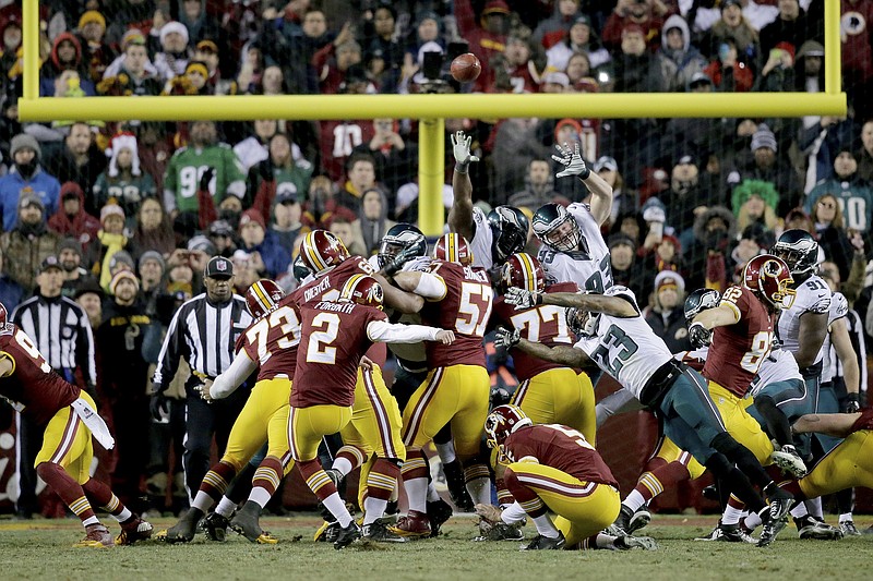 
              Washington Redskins kicker Kai Forbath (2) boots a field goal during the second half of an NFL football game against the Philadelphia Eagles in Landover, Md., Saturday, Dec. 20, 2014, to give the Redskins a 27-24 victory over the Eagles. (AP Photo/Mark Tenally)
            