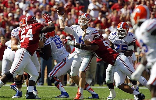 Florida quarterback Jeff Driskel (6) throws a pass while under pressure from Alabama lineman D.J. Pettway (57) during their game on Sept. 20, 2014, in Tuscaloosa, Ala.