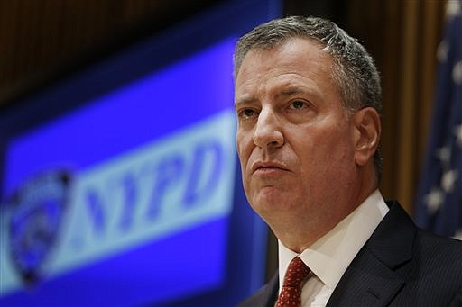 New York City Mayor Bill de Blasio listens during a news conference at police headquarters in New York on Monday, Dec. 22, 2014. 