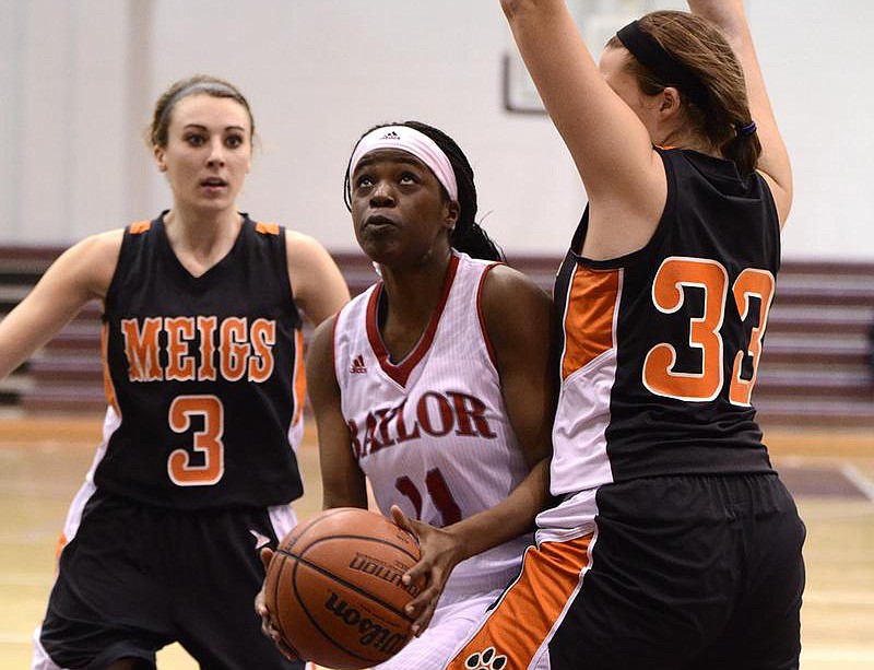 Baylor's Abby Hubert (11) goes up for a shot against Meigs County.