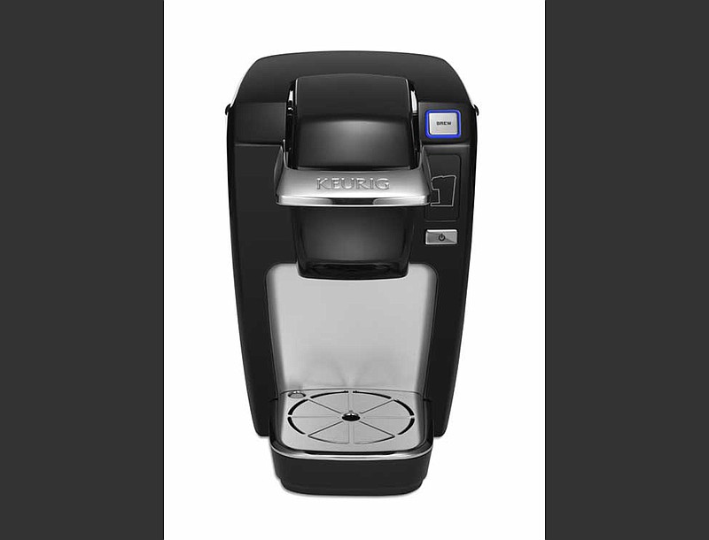 
              This undated product image from Keurig and released by the Consumer Product Safety Commission shows the Keurig Mini Plus coffee brewer. Keurig is recalling more than 7 million of the single-serve coffee brewing machines after reports that a number of them had spewed hot liquids and injured dozens of users, the company said Tuesday, Dec. 23, 2014. (AP Photo/Keurig via the Consumer Product Safety Commission)
            