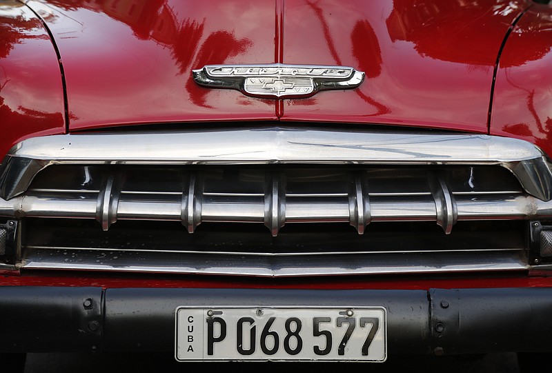 The detail of the front end of a recently painted 1952 Chevrolet sits parked in Havana, Cuba, Sunday, Dec. 21, 2014. U.S. car sales have been banned in Cuba since 1959, forcing Cubans to patch together Fords, Chevrolets and Chryslers that date back to before Fidel Castro's revolution.