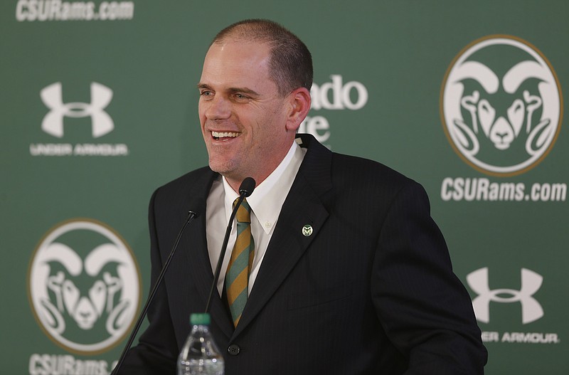 Mike Bobo jokes with reporters during his introduction as the new head football coach at Colorado State at a news conference Tuesday, in Fort Collins, Colo.