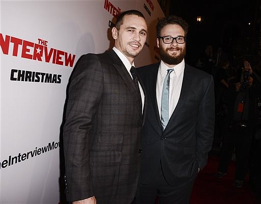 In this Dec. 11, 2014, file photo, actors Seth Rogen, right, and James Franco attend the premiere of the Sony Pictures' film "The Interview" in Los Angeles.