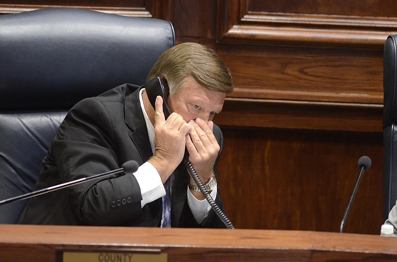 Hamilton County Mayor Jim Coppinger speaks on a telephone during a meeting of the Hamilton County Commission.