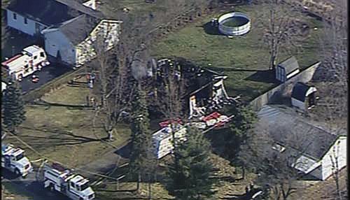 
              This aerial photo taken from video provided by WCMH-TV shows a burned out home in Washington Court House, Ohio, on Friday, Dec. 26, 2014. An Ohio fire marshal's spokesman said four bodies have been pulled from the burned-out Ohio home where three children were visiting their grandmother. The fire was reported early Friday. Authorities said the single-story house was destroyed. (AP Photo/WCMH-TV)
            