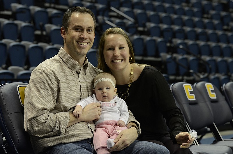 Nick, Jordan and Katie Burrows, from left, smile during a visit to  McKenzie Arena in Chattanooga.