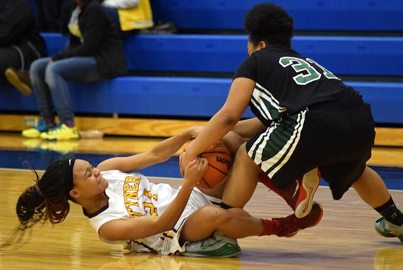 Tyner's Jerri Christopher (24) fights for a loose ball with Notre Dame's Meme Siler (31).  The Notre Dame Lady Irish faced the Tyner Academy Rams in the first round of the Chattanooga Times Free Press Best of Preps Tournament hosted by Chattanooga State Community College.