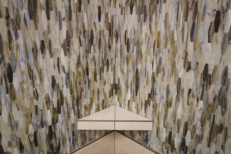 The elongated e-hex tile adds visual interest to a shower design at Louisville Tile.