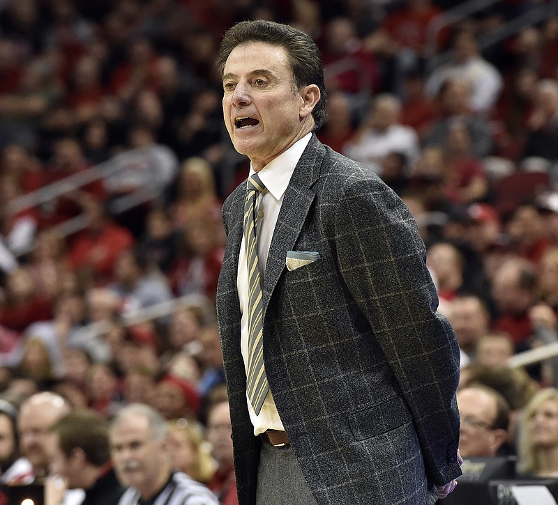 
              Louisville coach Rick Pitino shouts instructions to his team during the second half of an NCAA college basketball game against Cal State Northridge, Tuesday Dec. 23, 2014, in Louisville, Ky. Louisville won 80-55. (AP Photo/Timothy D. Easley)
            