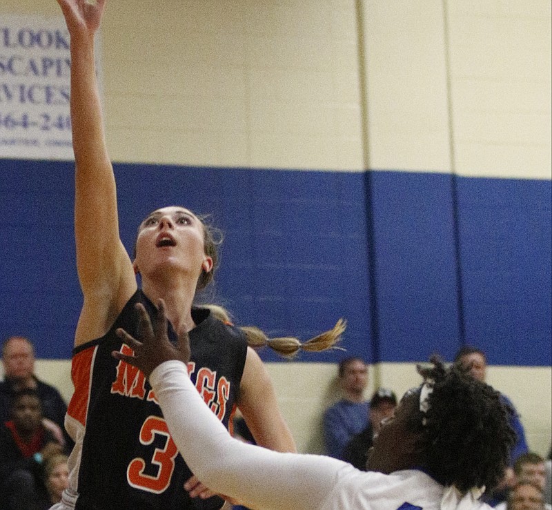 Meigs County's Taylor Boggess, left, shoots over GPS's Kare Ware during their Best of Preps Basketball Tournament semifinal game on Dec. 27, 2014, at Chattanooga State Technical Community College.