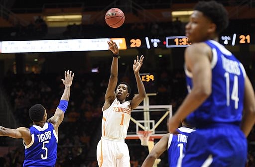 Tennessee guard Josh Richardson (1) shoots a 3-point basket over Tennessee State guard Jay Harris (5) during their game in Knoxville on Saturday, Dec. 27, 2014. Tennessee won 67-46. 