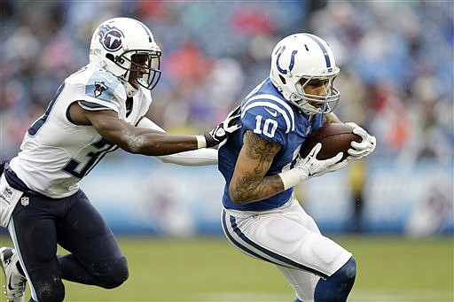 Indianapolis Colts wide receiver Donte Moncrief (10) catches a pass as he is defended by Tennessee Titans cornerback Jason McCourty (30) in their game on Dec. 28, 2014, in Nashville.