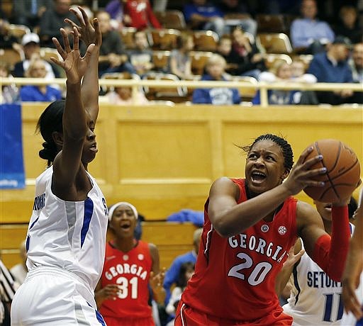 Georgia's Shacobia Barbee (20) looks to shoot as Seton Hall's Chizoba Ekedigwe (3) defends during their game at Walsh Gym in South Orange, N.J., on Dec. 28, 2014. Seton Hall defeated Georgia 70-51.
