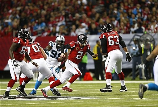 Atlanta Falcons quarterback Matt Ryan (2) runs out of the pocket against the Carolina Panthers during their game, Sunday, Dec. 28, 2014, in Atlanta. 