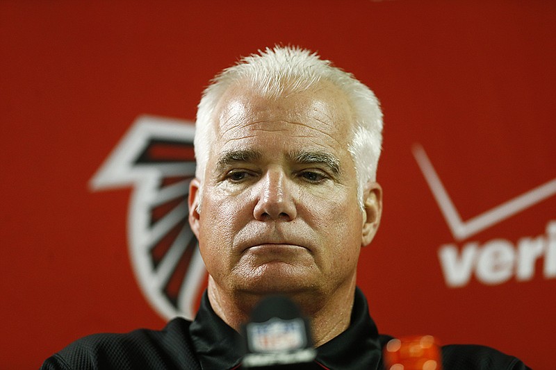 Atlanta Falcons head coach Mike Smith speaks at a news conference after the loss against the Carolina Panthers in Atlanta.