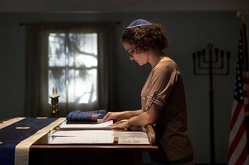 Student rabbi Sara Eiser, visiting from rabbinical school in Cincinnati, Ohio, goes over her notes before shabbat service at the Synagogue of the Black Hills in Rapid City, S.D., in this Sept. 12, 2014 photo.