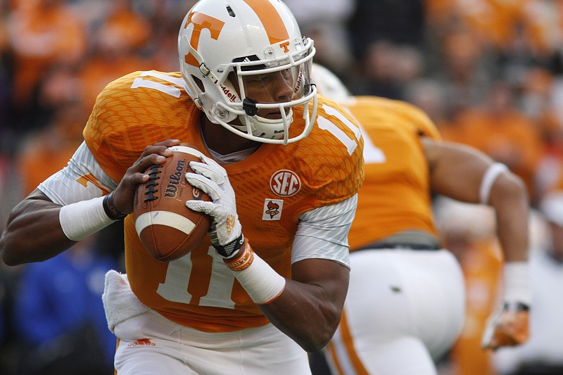 Tennessee quarterback Joshua Dobbs (11) looks for an open receiver while playing Kentucky in this file photo.