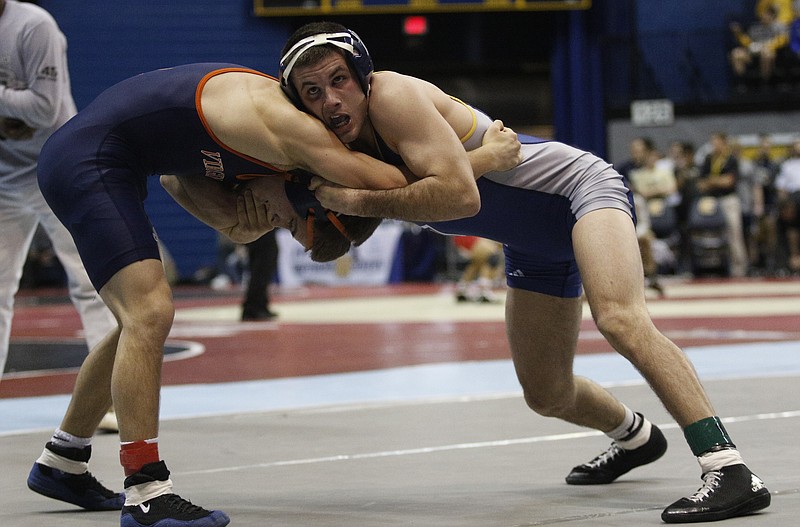UTC's Sean Boyle, right, wrestles Virginia's Will Mason in their Southern Scuffle 125 lb class wrestling championship round of 16 match Thursday, Jan. 1, 2015, in McKenzie Arena in Chattanooga.