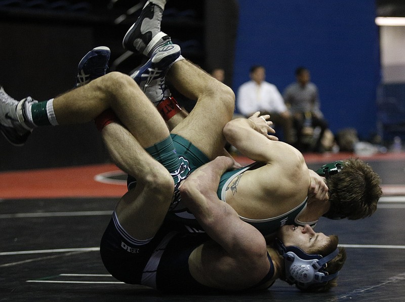 Penn State's Jordan Conaway, bottom, flips Cleveland State's Ben Willeford in their Southern Scuffle 125 lb class wrestling championship on Thursday, Jan. 1, 2015, in McKenzie Arena in Chattanooga.