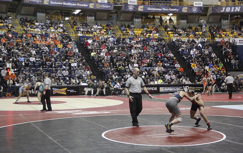 Wrestlers compete in Southern Scuffle wrestling championship round of 16 matches Thursday, Jan. 1, 2015, in McKenzie Arena in Chattanooga.