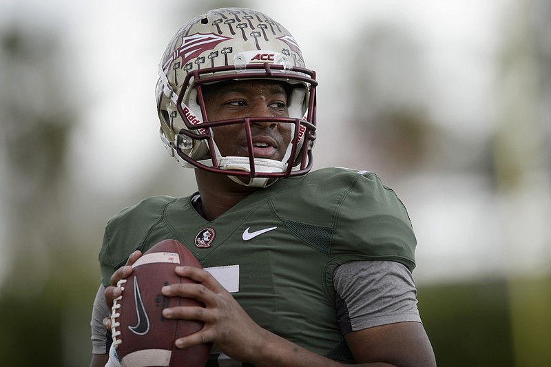 
              Florida State quarterback Jameis Winston throws the ball to warm up during an NCAA college football practice in Carson, Calif., Tuesday, Dec. 30, 2014. Florida State is scheduled to play Oregon in the Rose Bowl NCAA college football playoff semifinal on New Year's Day. (AP Photo/Kelvin Kuo)
            