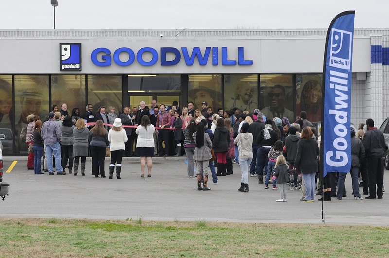 Staff Photo by Tim Barber
Dozens of shoppers wait to enter the newly remodeled Goodwill store on South Terrace Friday as officials open the store with a ribbon cutting in East Ridge. All new items are available for the first time in this store.