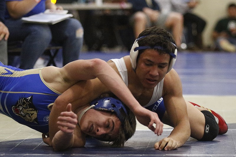 Cleveland's Chris Debien, right, wrestles Wilson Central's Lane Dickeson in their championship 132-lb class Soddy-Daisy Invitational wrestling bout Saturday, Jan. 3, 2015, at Soddy-Daisy High School in Soddy-Daisy, Tenn. Debien won and took 1st place in his class.