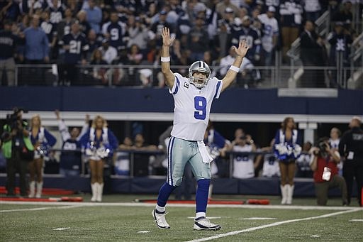 Dallas Cowboys quarterback Tony Romo (9) reacts to a touchdown during his game against the Detroit Lions, Sunday, Jan. 4, 2015, in Arlington, Texas. 