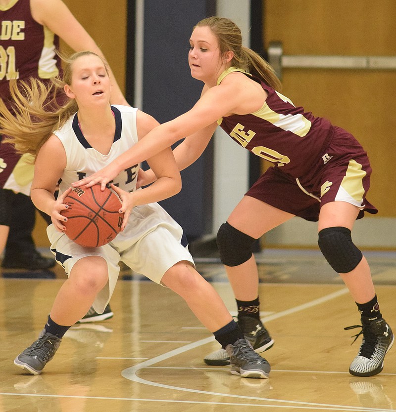 Dade County's Cassidy Cole (10) tries to strip the ball from Gordon Lee's Mary Pritchett (21). The Dade County High School Lady Wolverines visited the Gordon Lee High School Lady Trojans in GHSA Basketball action Tuesday night.