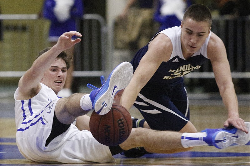 McCallie's Robert Riddle, left, and Hamilton Heights' Strahinja Micakovic try to recover a loose ball Wednesday at McCallie Schoo.