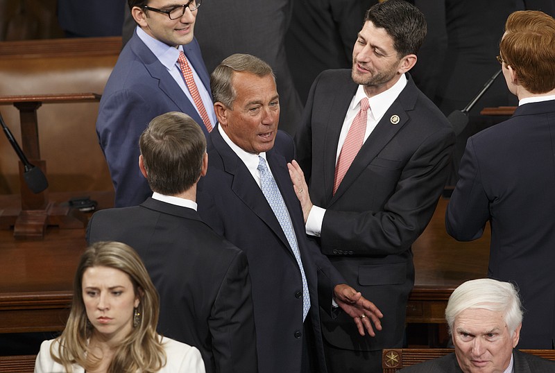 
              House Ways and Means Committee Chairman Rep. Paul Ryan, R-Wis., greets House Speaker John Boehner of Ohio, on Capitol Hill in Washington, Tuesday, Jan. 6, 2015,  as the House of Representatives gathered for the opening session of the 114th Congress. Boehner is expected to win a third despite a tea party-backed effort to unseat him.   (AP Photo/J. Scott Applewhite)
            