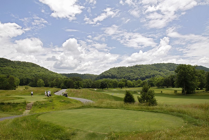 Golfers tee off on hole 8 at the Honors Course in Ooltewah, Tenn.