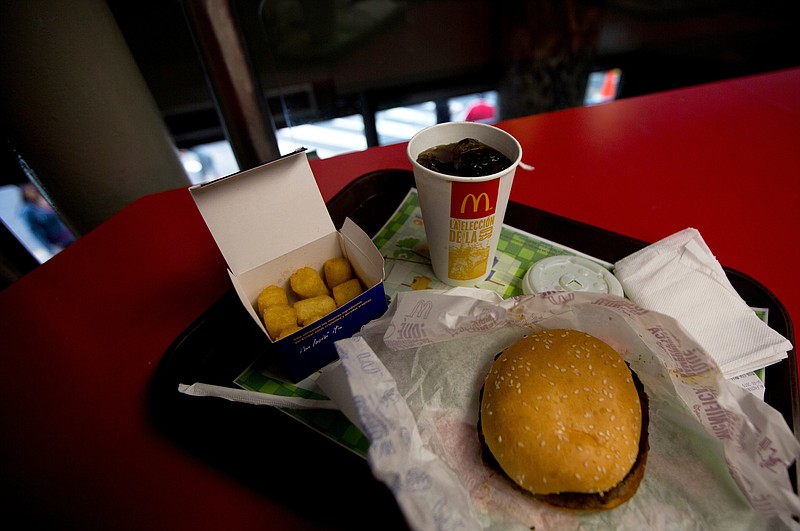 A Quarter Pounder meal is served with arepas or corn cakes at a local McDonald's, in Caracas, Venezuela, on Tuesday, Jan. 6, 2015. 