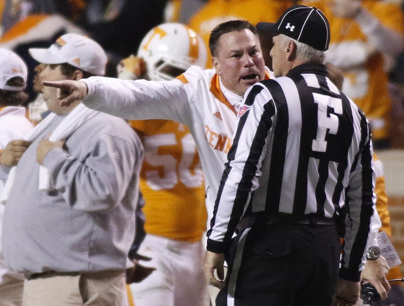 UT head coach Butch Jones shouts to field judge Blake Parks during the Vols' 29-21 loss to the Missouri Tigers in November.