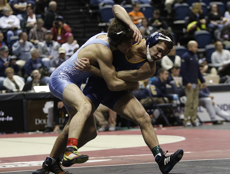 UTC's Nick Soto, right, wrestles North Carolina's Troy Heilmann in their Southern Scuffle 133 lb class wrestling championship round of 16 match Thursday, Jan. 1, 2015, in McKenzie Arena in Chattanooga, Tenn.
