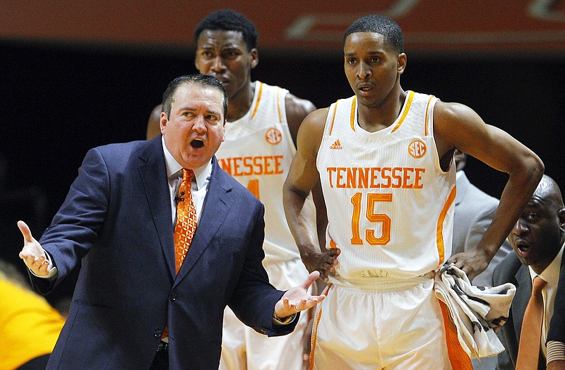 Tennessee head coach Donnie Tyndall talks with Tennessee guard Detrick Mostella (15) in their game against East Tennessee State on Dec. 31, 2014, in Knoxville.