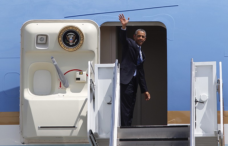 President Barack Obama boards Air Force One to depart from the TAC Air terminal at Lovell Field in Chattanooga on Tuesday, July 30, 2013. (Photo by Dan Henry)